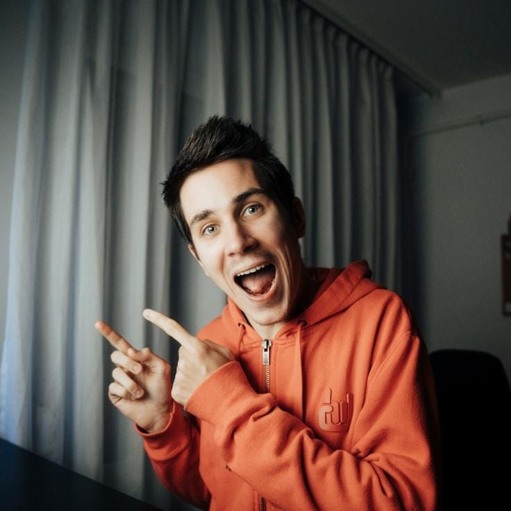 Avery Chen, Lead Design Curator at Harbor Paper Land, reviewing corporate floral arrangements